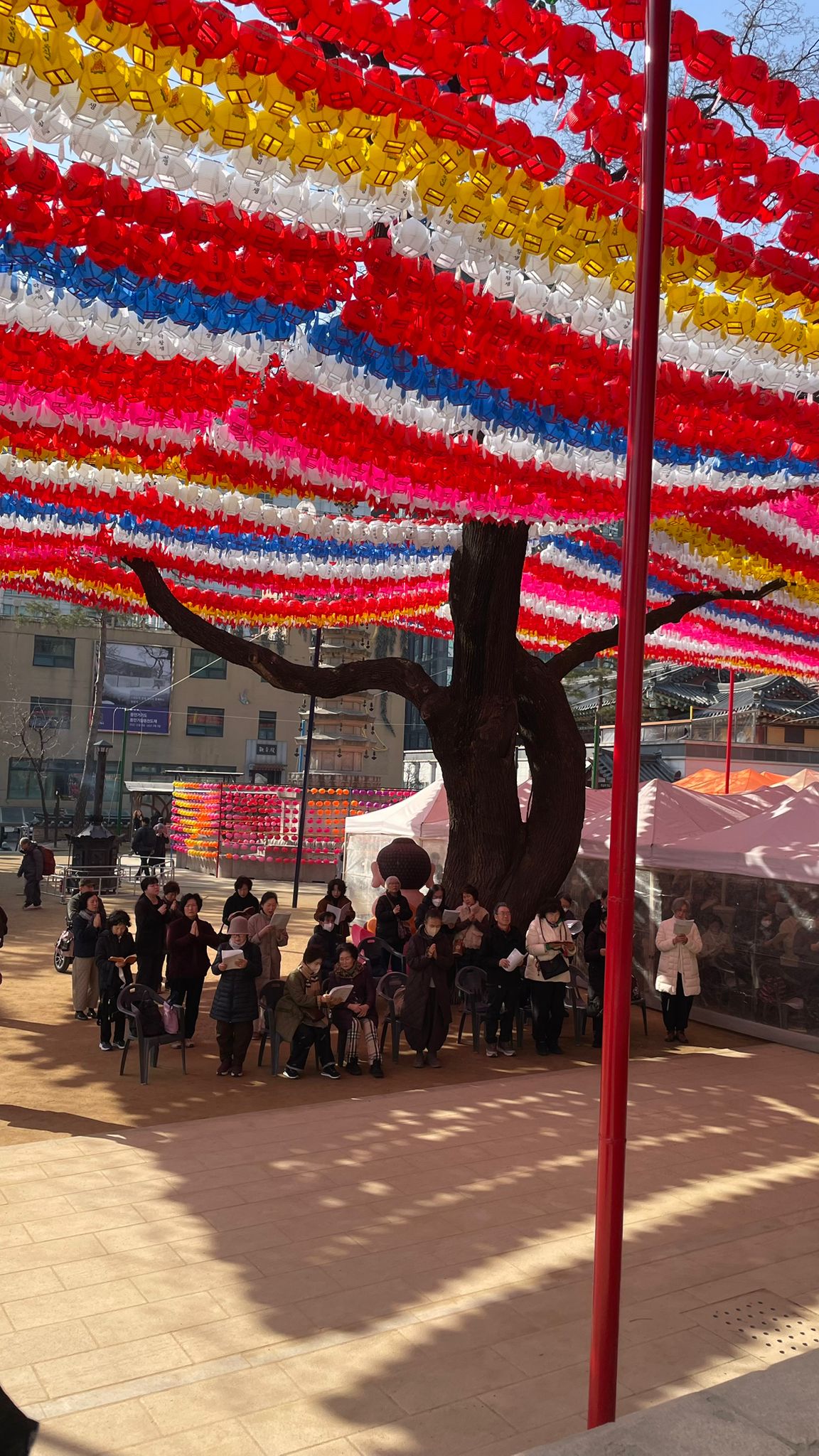 Modern Buddhist outreach building opposite Jogyesa Temple with mandala facade designs